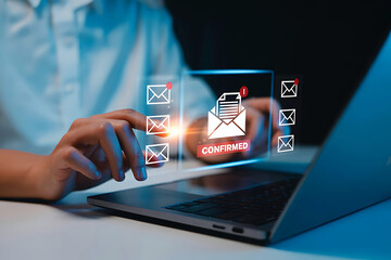 Person using a laptop with digital email icons and notifications floating above