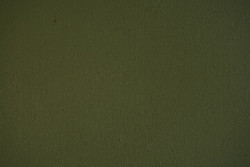 Dark green matte surface texture with subtle grain and minimal irregularities. Simple solid background ideal for design, graphics, and 3D materials.