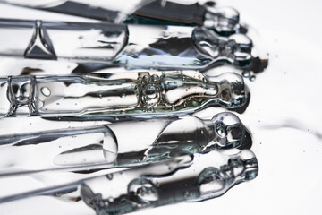 Cosmetic pipettes with serum on a transparent background macro. Beauty, aromatherapy and relaxation.
