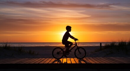 Fototapeta premium Child on Bike at Beach Boardwalk Sunset