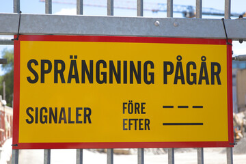 Warning sign of explosions regarding construction work in Sweden