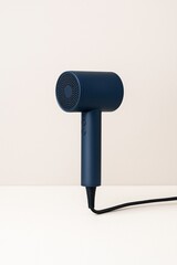 Navy Blue Electric Hair Dryer on White Surface