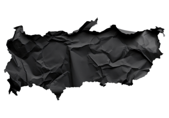 Crinkled black paper, roughly shaped like a country, on a black background
