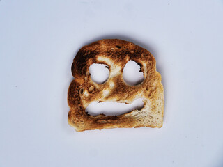 A cheerful slice of toasted bread with a smiling face