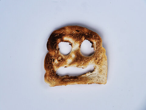 A cheerful slice of toasted bread with a smiling face
