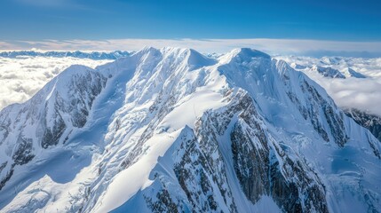 Obraz premium A majestic view of a snow-covered mountain range in the Alaskan wilderness.