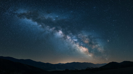 Fototapeta premium Milky Way galaxy stretching over a dark mountain horizon, astrophotography style