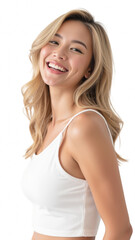 Fototapeta premium Smiling woman with long blonde hair wearing white tank top, exuding joy and confidence. Bright background enhances her cheerful expression