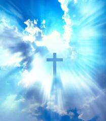 Christian cross appears bright on the blue sky