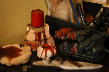 Candles and incense holders prepared for spiritual meditation or yoga practice as the art composition of handmade objects and wax traces