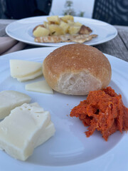 Traditional Italian appetizer with crusty bread topped with melted provola cheese and spicy Calabrian ’nduja