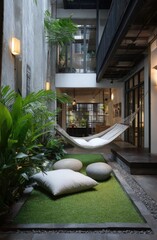 Interior courtyard with lush greenery, hammocks, and comfortable seating