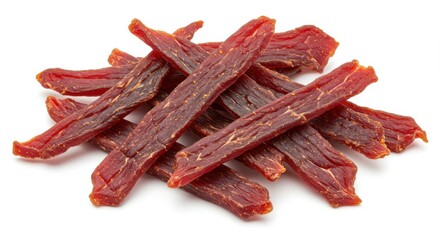 Pile of delicious dried beef jerky strips on a white background