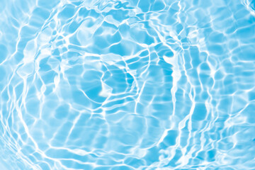 Blue water with ripples on the surface. Defocus blurred transparent blue colored clear calm water...