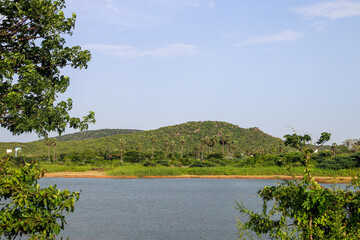 Fototapeta premium Beautiful landscape with lake, clouds and trees near chennai tamil nadu 