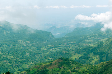 Breathtaking view of Kodaikanal mountains showcasing lush greenery and serene valleys on a clear day