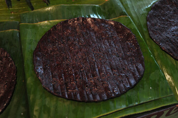 Black sticky rice with sesame seeds on banana leaf. It is famous is a snack of northern Thailand. 
