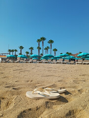 deckchairs and parasols on the beach in Saint-Tropez
