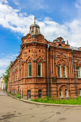 Fototapeta premium Historic building of House of merchant A.D. Vasenev in Biysk, Russia. Brick mansion built in 1904. Building is a monument of architecture and cultural history