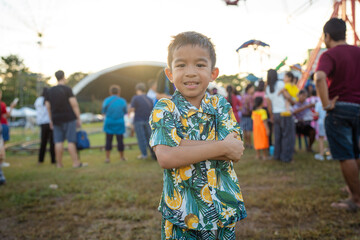 Happy little boy enjoy outdoor theme park festival