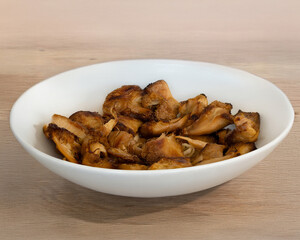 Golden Fried Lion's Mane Mushroom Pieces in a White Bowl