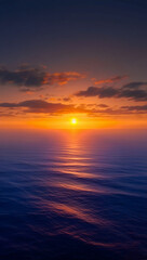 Obraz premium Vibrant sunset over calm ocean with colorful sky and reflections