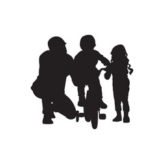 Family bike lesson silhouette. Parent kneeling beside two children one on a bike, one watching.