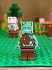 Naklejka premium Minecraft Lego Zombie Minifigure on Green Baseplate