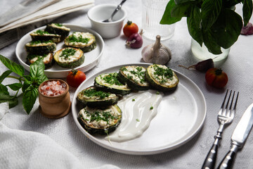Appetizing Fried zucchini with garlic sauce in a white plate