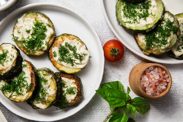 Appetizing Fried zucchini with garlic sauce in a white plate