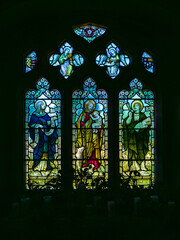 Stained glass window depicting saints in The Parish Church of Saint Mary (Lower Slaughter, Gloucestershire, England, United Kingdom)