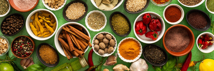 A colorful assortment of fresh, fragrant spices and herbs displayed on a soft green background, capturing a vibrant culinary essence, banner