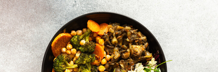 A vibrant, protein-packed breakfast with black quinoa, avocado, chicken, roasted veggies like sweet potato, broccoli, and a fresh salad of cabbage, radish, chia, and sesame seeds, banner