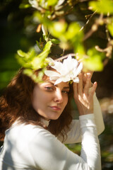 An Elegant Woman is gracefully surrounded by Vibrant Blossoms in a Beautiful Natural Outdoor Setting