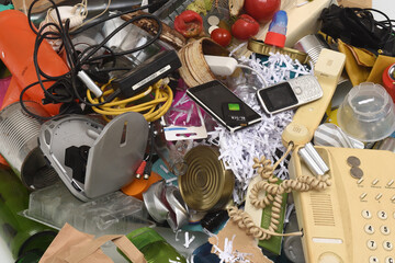 close up of  garbage with plastic containers, glass, cans, paper, organic,e-waste, on white background