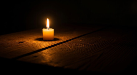 Solemn flickering candle in darkness, symbolizing peace, remembrance, and hope. Perfect for vigils, memorial tributes, and quiet contemplation.