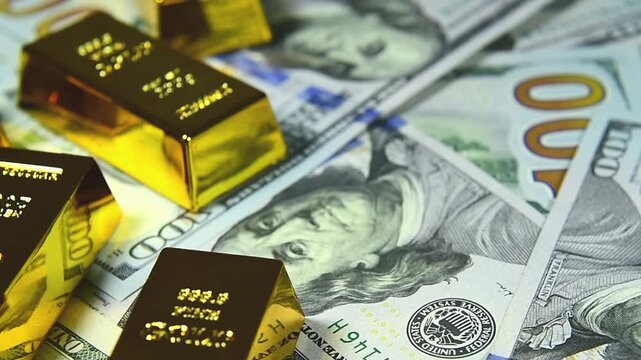 Paper us 100 dollar bill with gold bars, concept of investment and saving, wealth