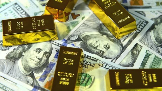 Paper us 100 dollar bill with gold bars, concept of investment and saving, wealth