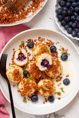 Blueberry curd dumplings with butter and cinnamon crumbs..top veiw.style hugge