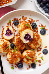 Blueberry curd dumplings with butter and cinnamon crumbs..top veiw.style hugge