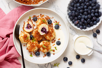 Blueberry curd dumplings with butter and cinnamon crumbs..top veiw.style hugge
