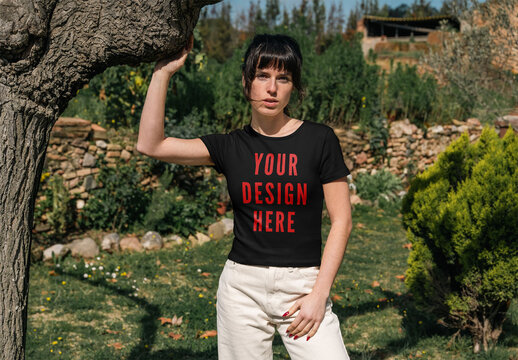 Mockup Of Woman Wearing Customizable T-Shirt By Tree