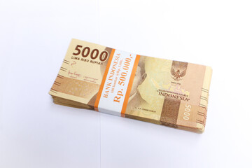 Stacked 5000 Banknotes On White Surface