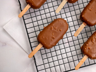 Top View of Chocolate-Covered Ice Cream Bar with Nuts