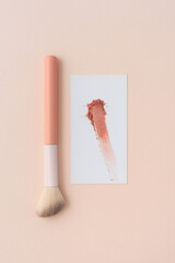 Blush Brush with Powder Sample on Pastel Background