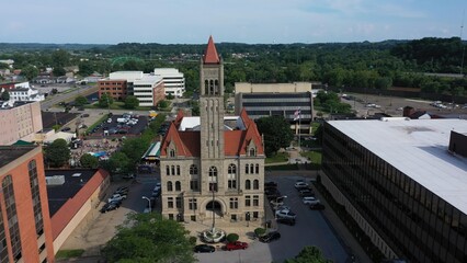 This aerial perspective highlights the historic courthouse in downtown Parkersburg, West Virginia, framed by lush hills and urban development.