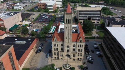 Vibrant aerial perspective of Parkersburg, West Virginia, highlighting historic buildings, the bustling downtown area, and the natural beauty along the Ohio River.