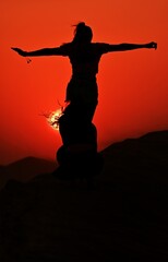 silhouette of a woman doing yoga