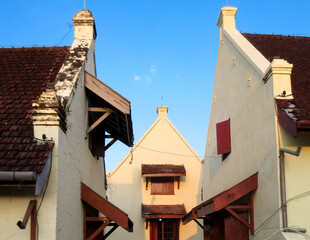 Old Town Houses With Red Tile Roofs And Wooden Overhangs