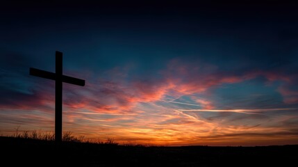 Fototapeta premium Silhouette of a cross against a vibrant sunset sky isolated on white background
